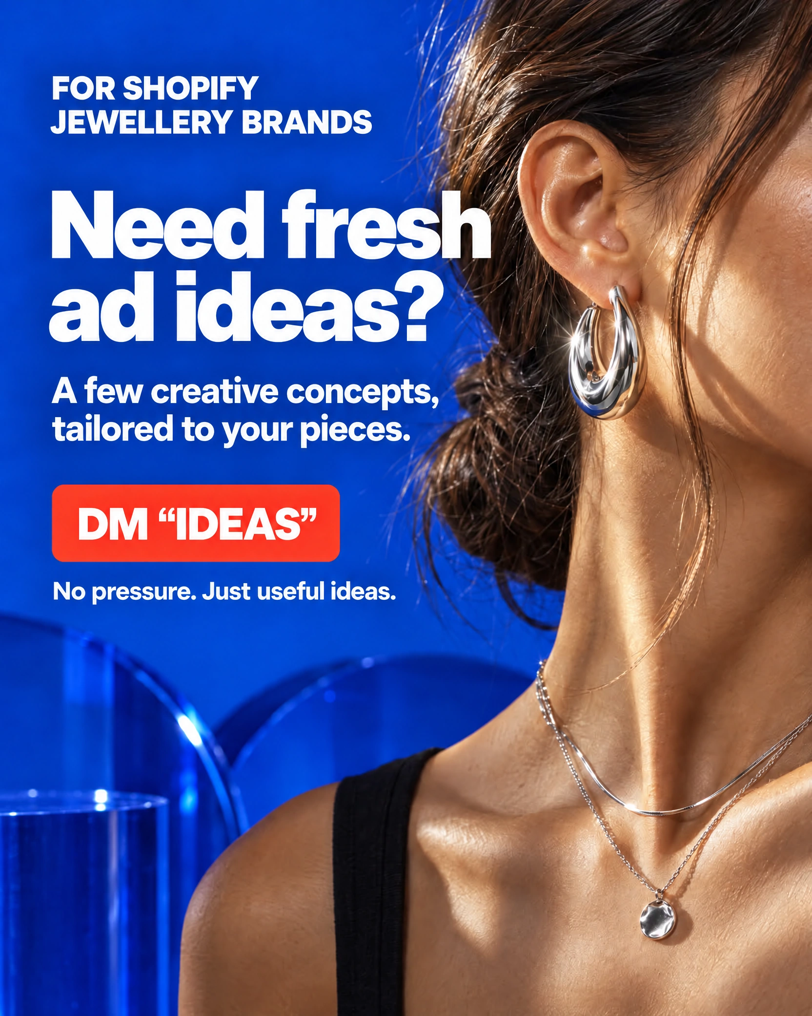 Blue Shopify jewellery ad showing silver hoop earrings and layered necklaces with the headline Need fresh ad ideas? and DM IDEAS call to action
